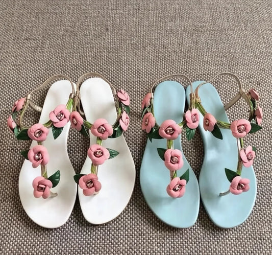 Pair of light blue floral thong slingback flat sandals
