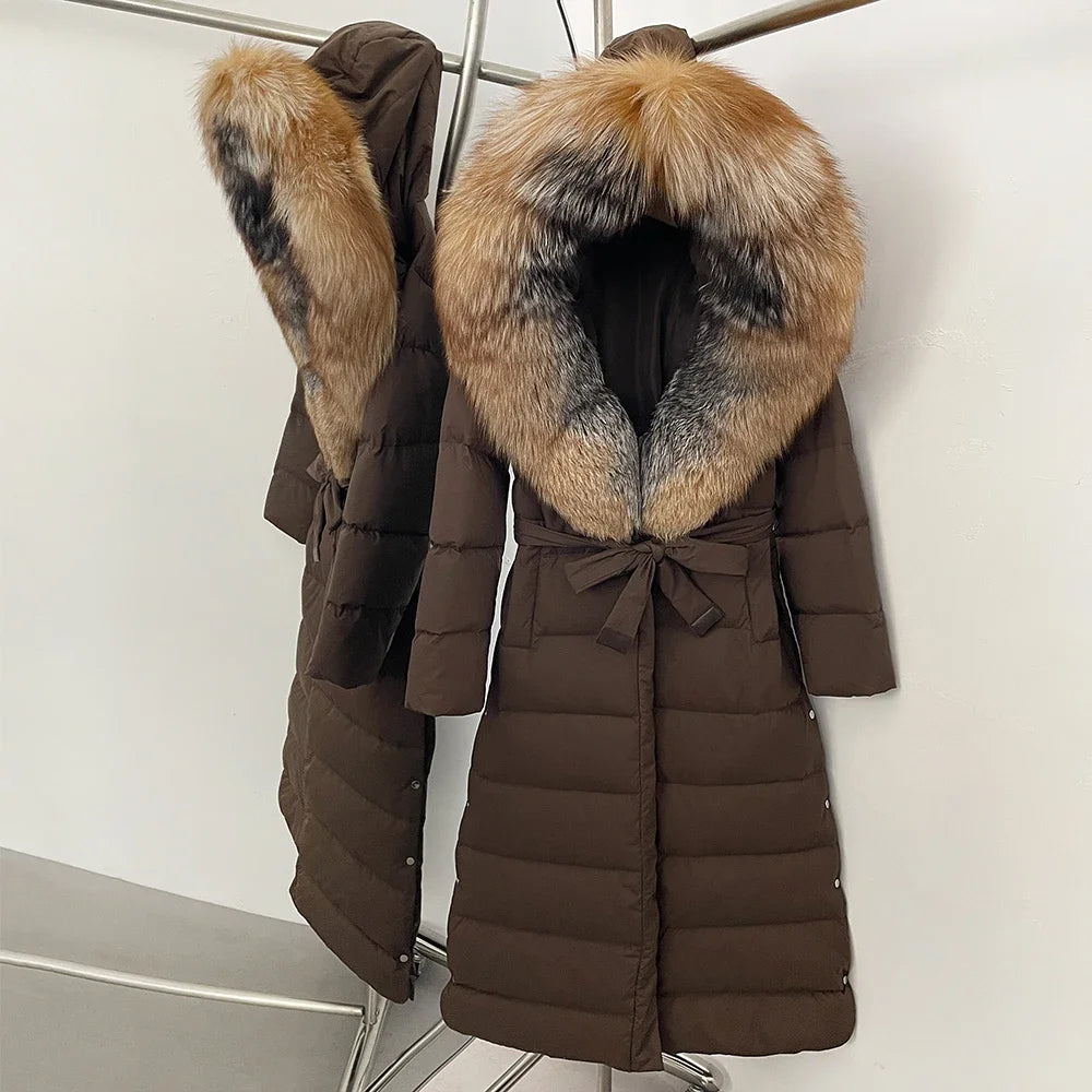 Brown puffer coat with fur hood on a white background