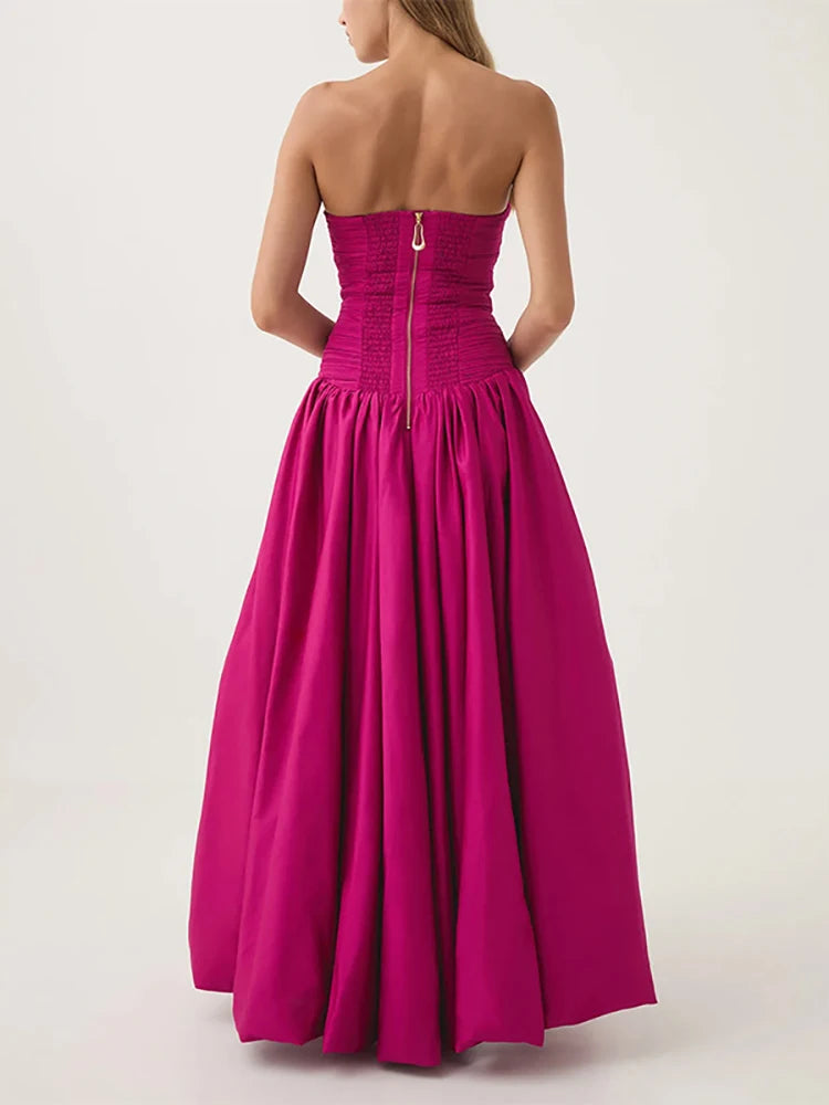 Pink strapless gown on a white background