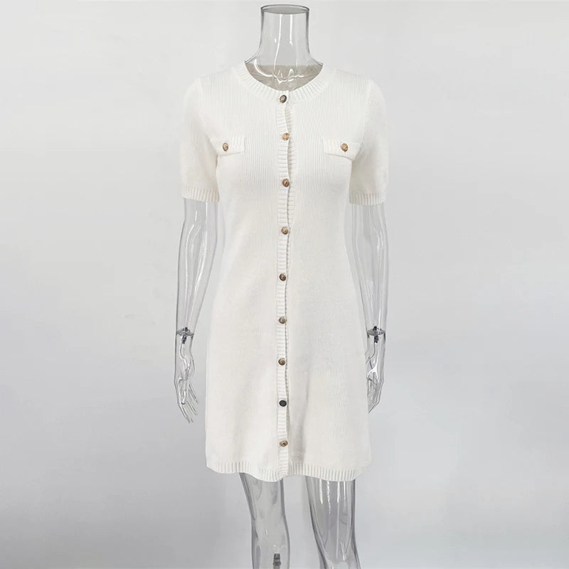 White cardigan on a mannequin against a white background