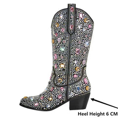 Decorative boot with colorful gemstones on a white background