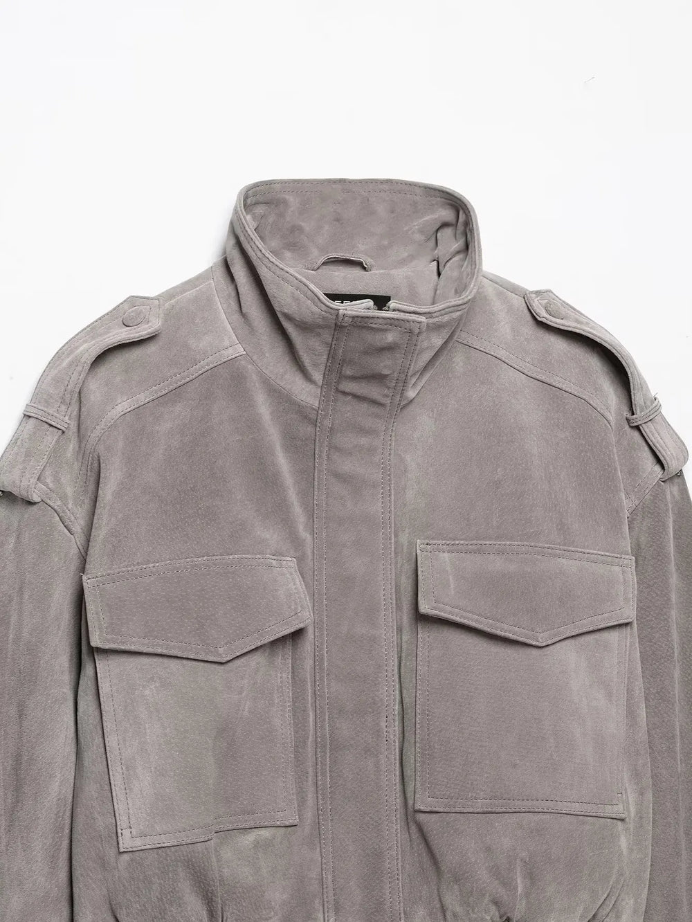 Close-up of high neck suede cropped jacket