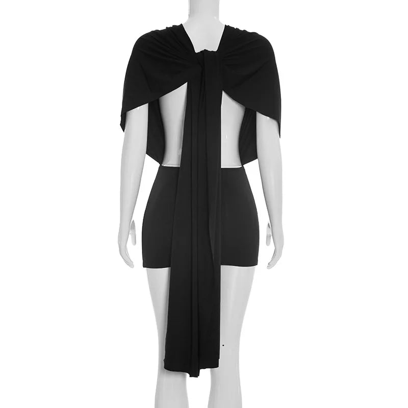 Black dress with cape on a mannequin against a white background