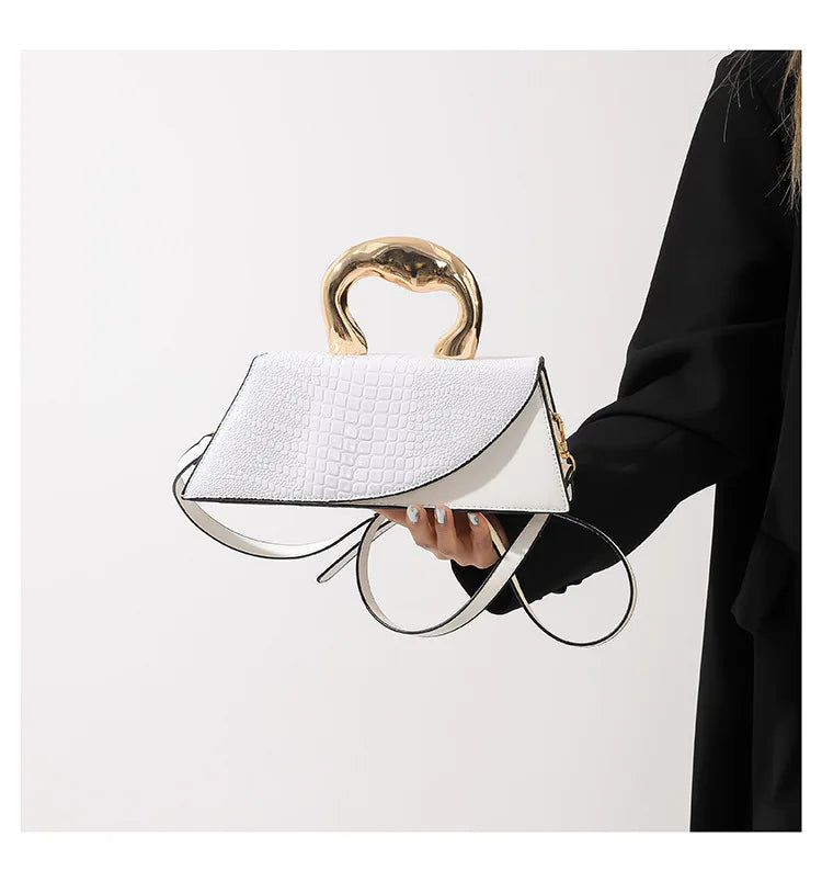 White alligator textured top handle bag with golden handle