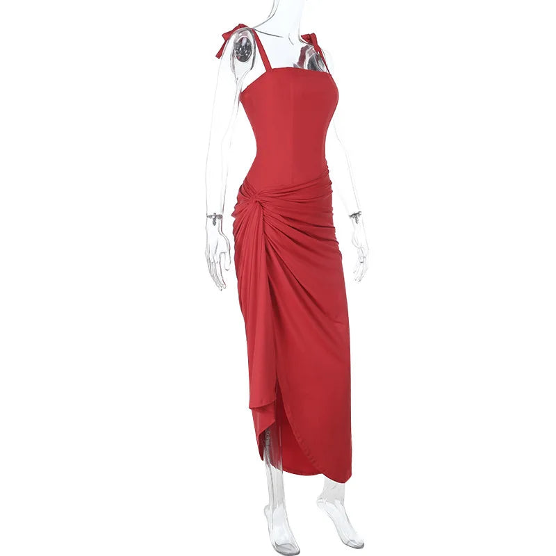 Red evening gown on a mannequin against a white background