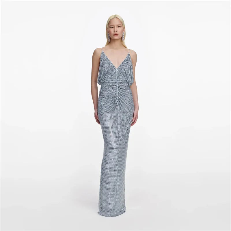 Full length view of crystal embellished V-neck maxi dress