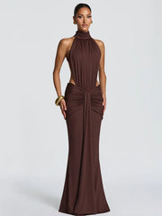 Woman wearing a brown evening gown on a white background