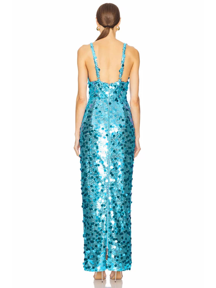 Woman wearing a blue sequin dress on a white background