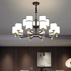 Modern LED chandelier with glass pendants, casting a warm glow in a stylish living room. Golden Atelier 4