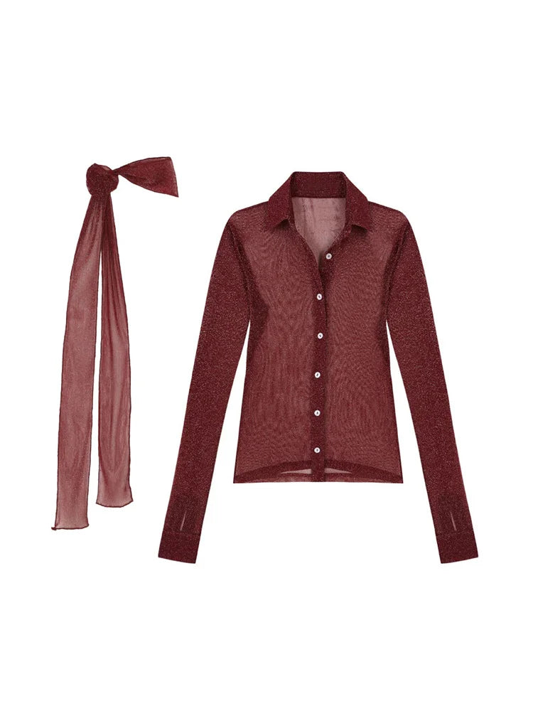 Maroon cardigan with a matching bow on a white background