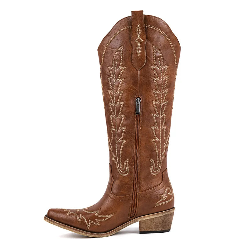 Side view of brown faux leather western boots showing zipper detail