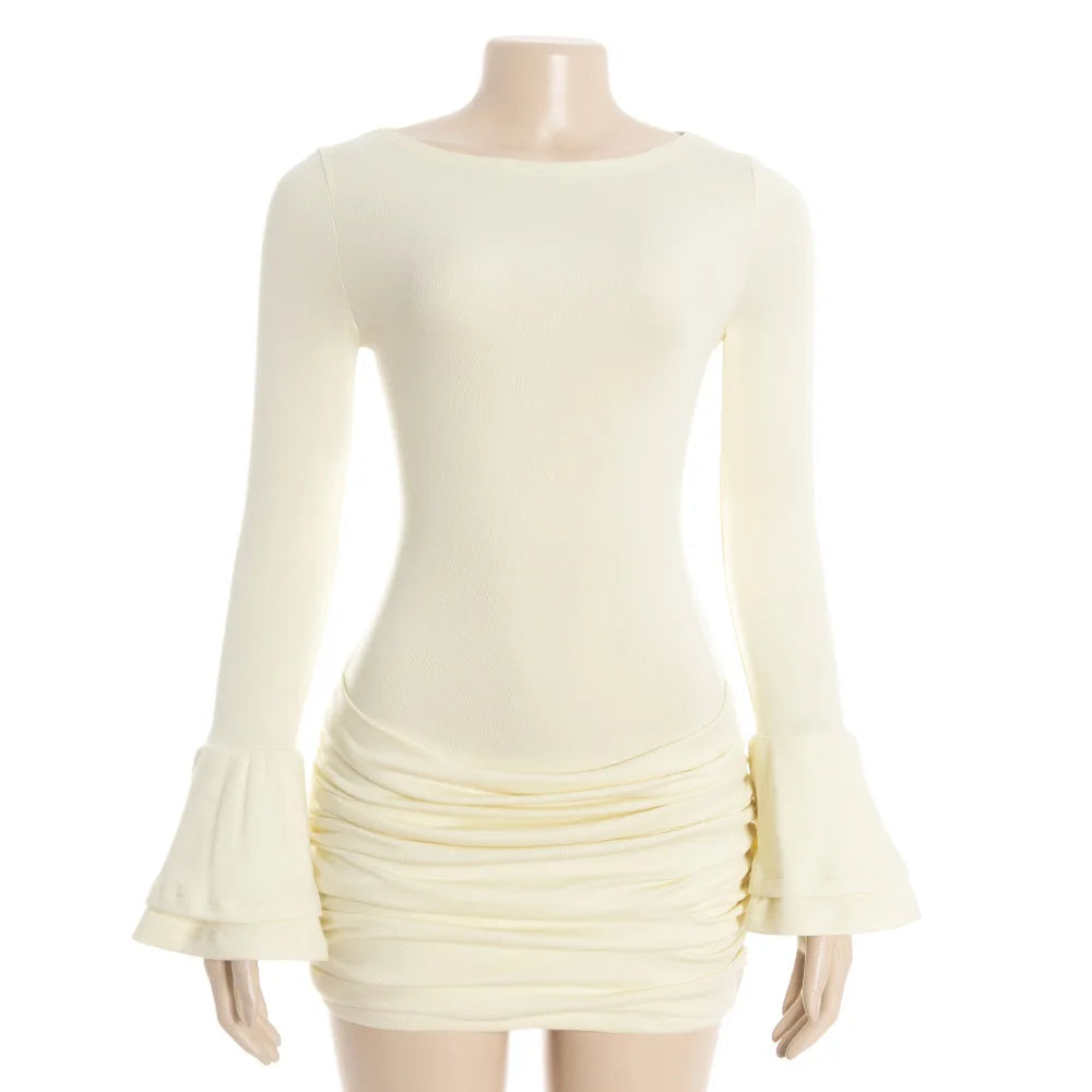 Cream-colored dress with ruched skirt on a mannequin against a white background