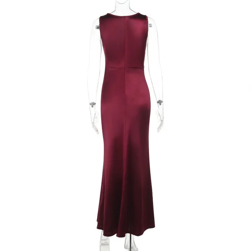 Maroon evening gown on a mannequin against a white background