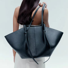 Textured PU Leather Top in black, worn on shoulder