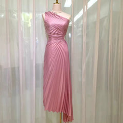 Pale pink asymmetrical one-shoulder gown on a mannequin.