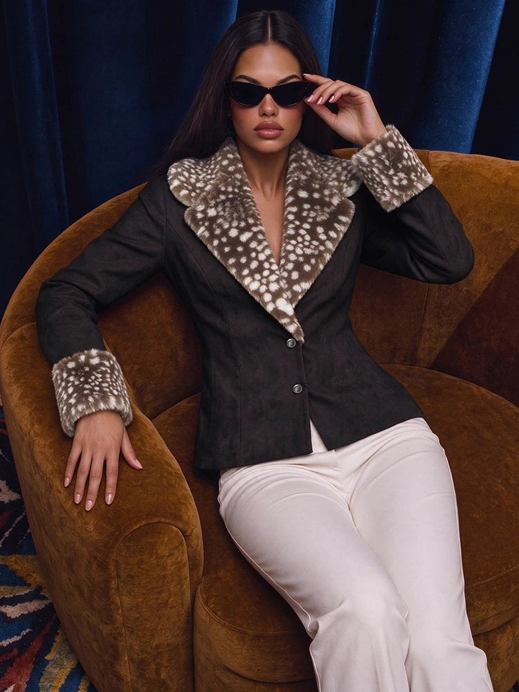 Black animal print fur trim jacket seated