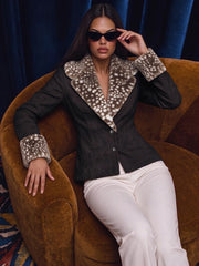 Black animal print fur trim jacket seated
