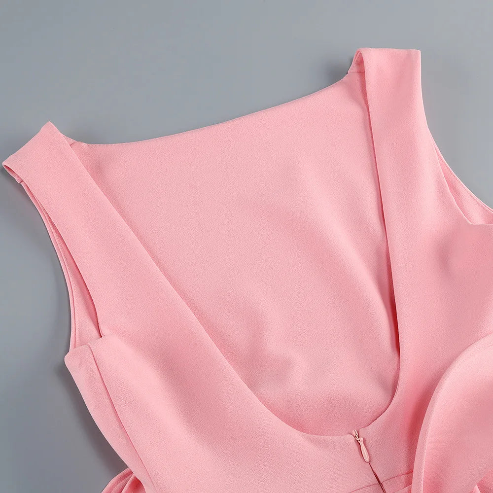 Pink sleeveless top on a gray background