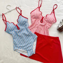 Blue striped bikini top and red skirt