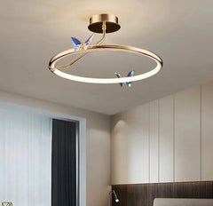 Modern ceiling light fixture with butterfly design in a room setting