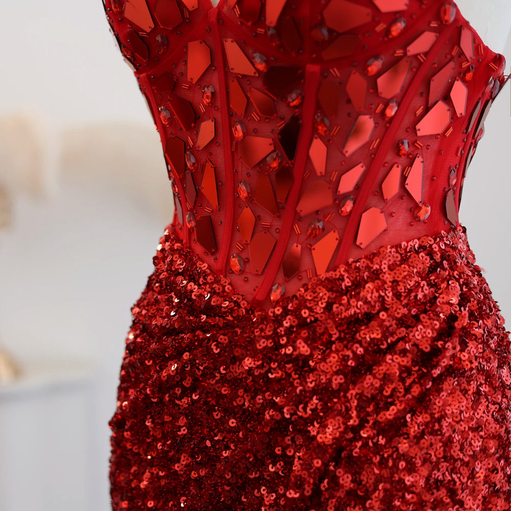 Close-up of a red sequin dress with intricate design on a blurred background