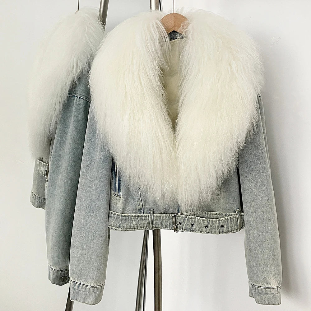 Denim jacket with white fur collar on a stand against a white background