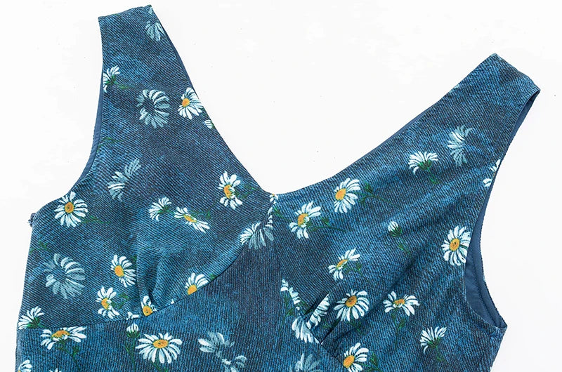 Close-up of the v-neckline on a daisy print maxi dress