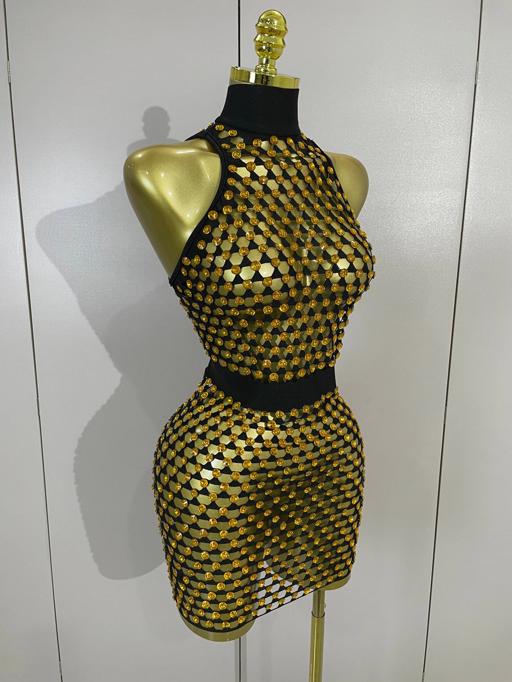 Back view of sparkling mesh mini dress on mannequin