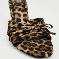 Close-up of the bow knot and leopard print pattern on the high heel slippers.  Golden Atelier 4