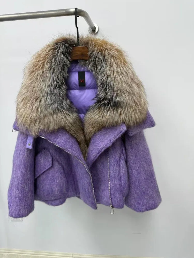 Purple coat with fur hood on a hanger against a white background