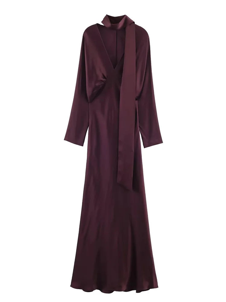Maroon evening gown with a draped front on a white background