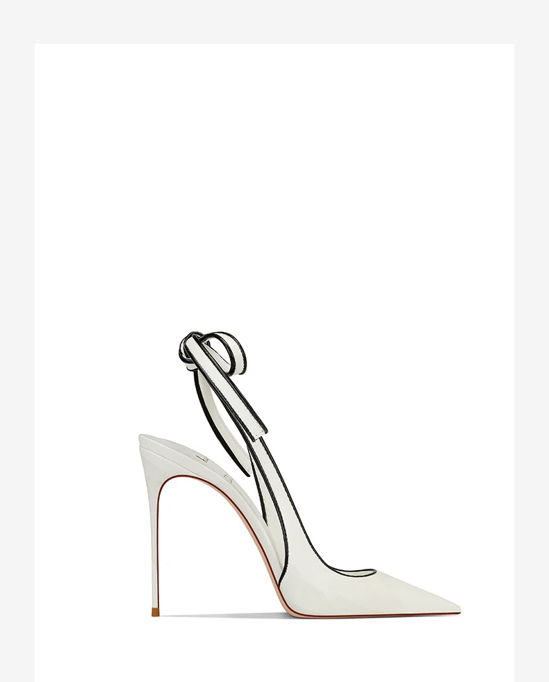 White high-heeled shoe with a bow on a white background