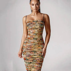 Close-up of ruched floral print midi dress with spaghetti straps