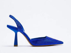 Side view of blue crystal slingback pointed toe pumps