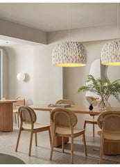 The Golden Atelier Wabi Sabi Rope Chandelier hanging above a dining table, creating a warm and inviting atmosphere. 4