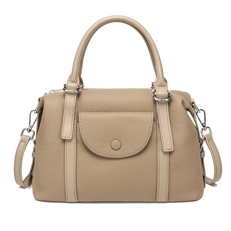 Beige handbag with a shoulder strap on a white background
