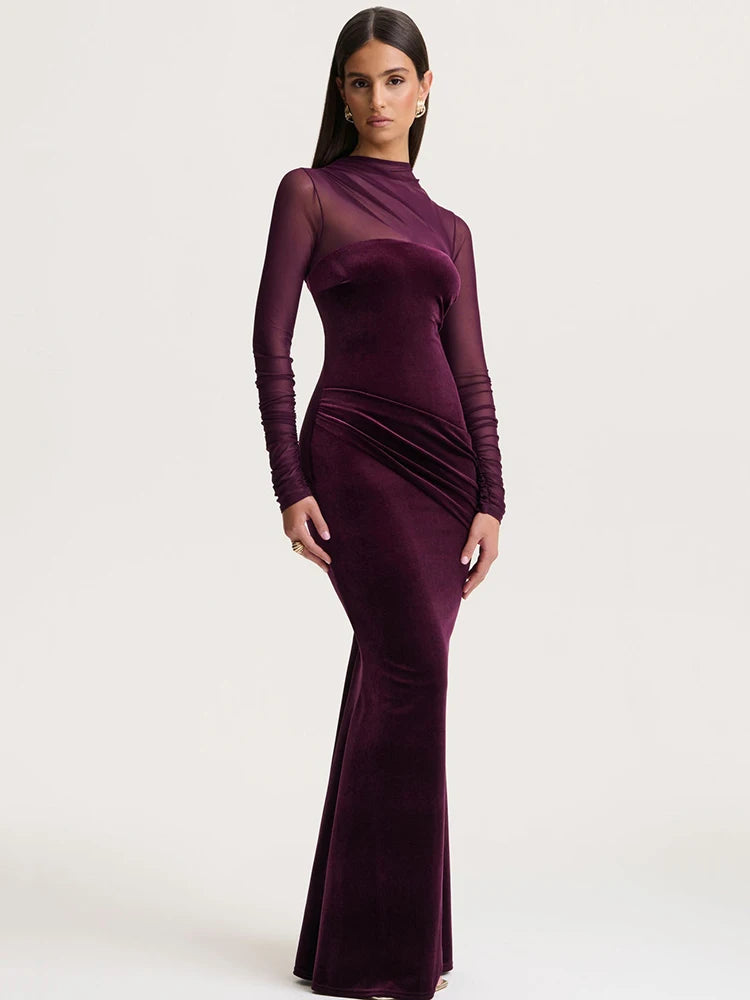 Woman wearing a burgundy evening gown on a white background