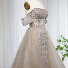 Mannequin displaying the champagne mermaid evening gown with overskirt, showcasing its flattering silhouette and graceful movement. Golden Atelier 4