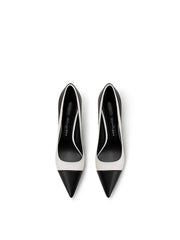 Top view of black and white pointed stiletto heel pumps