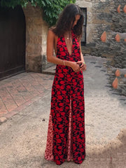 Red floral print maxi dress with a plunging neckline and thigh-high slit.