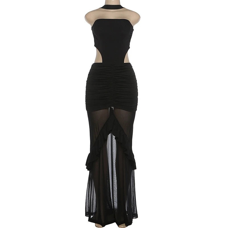 Black dress with sheer panels on a mannequin against a white background