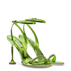 Close-up of a Golden Atelier high heel sandal with a diamond-encrusted ankle strap, highlighting the intricate details. Green 3