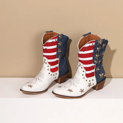 Pair of cowboy boots with American flag design on a beige background