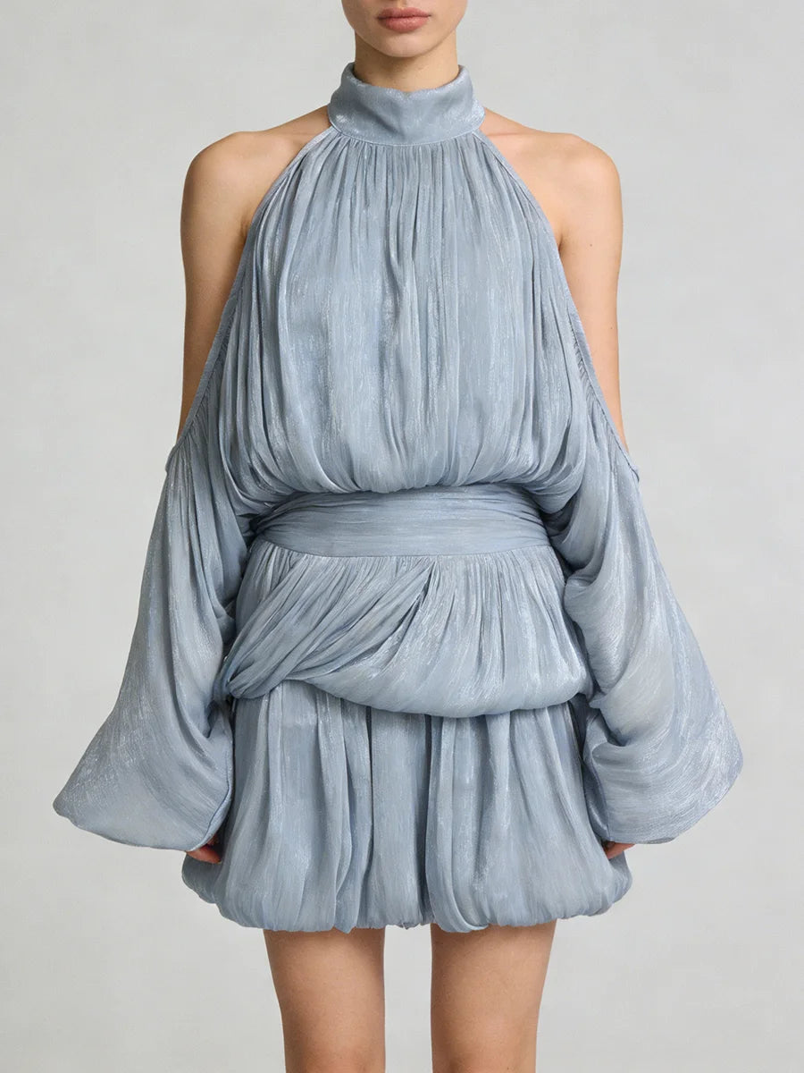 Blue halter neck dress with a layered design on a plain background