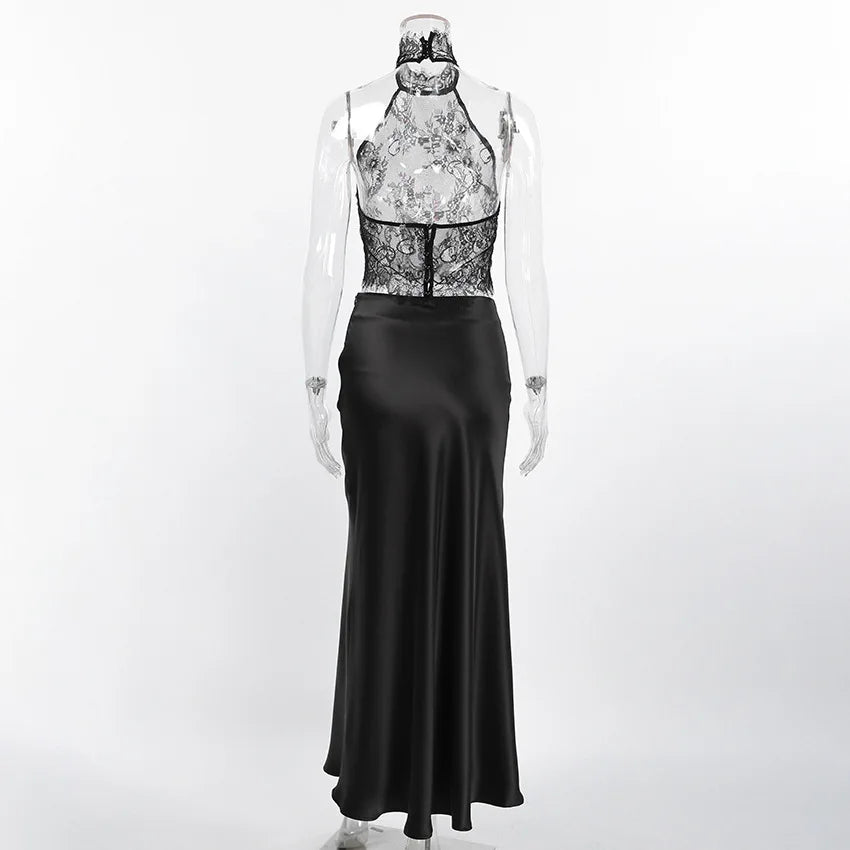 Mannequin wearing a black evening gown with floral lace top on a white background