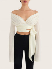 Off shoulder wrap crop top with bell sleeves and black pants