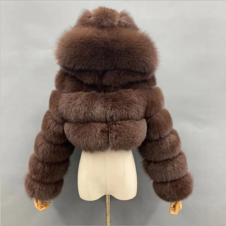 Brown fur jacket on a mannequin against a gray background
