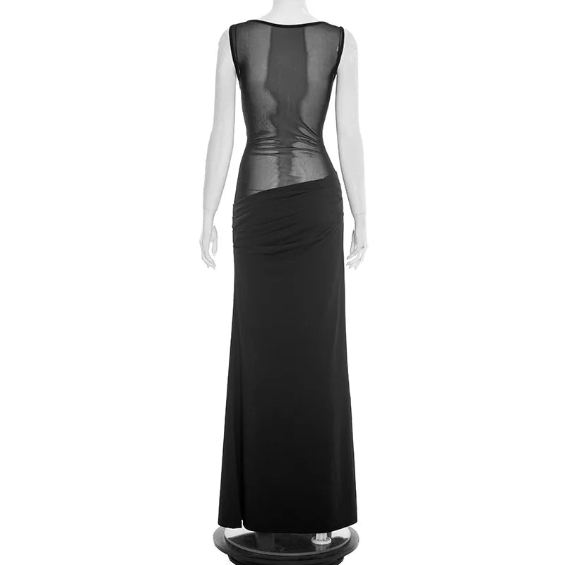 Black evening gown with sheer back on a mannequin against a white background