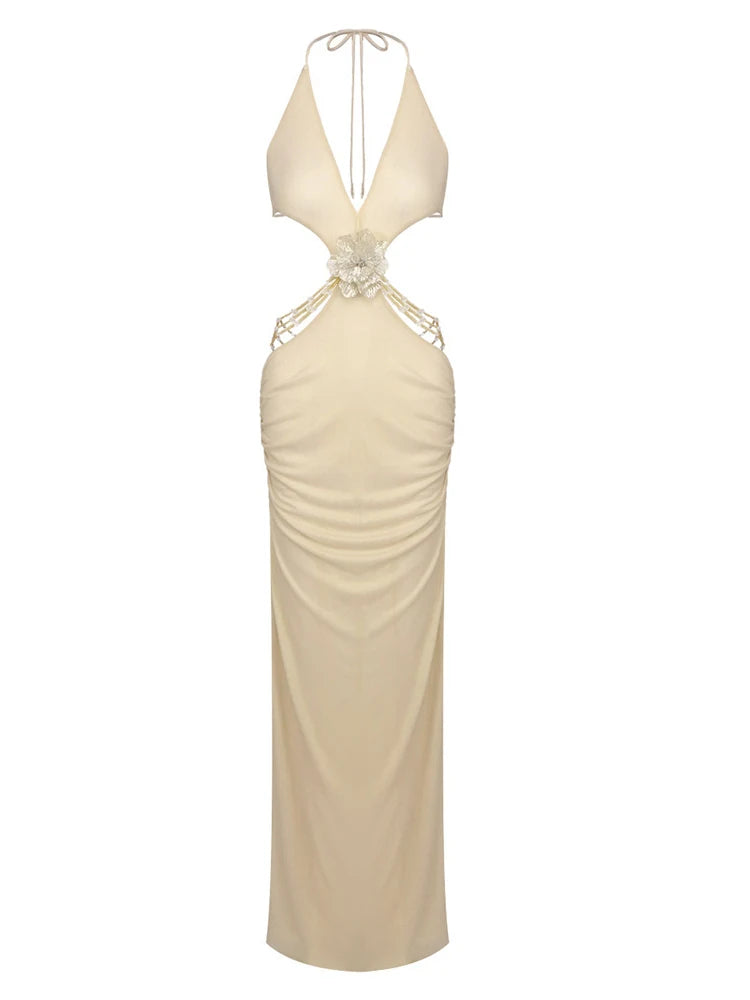 Beige evening gown with intricate detailing on a white background