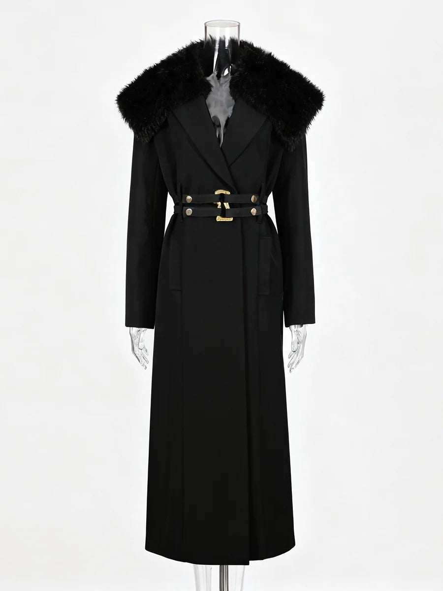 Black coat with fur collar on a mannequin against a white background